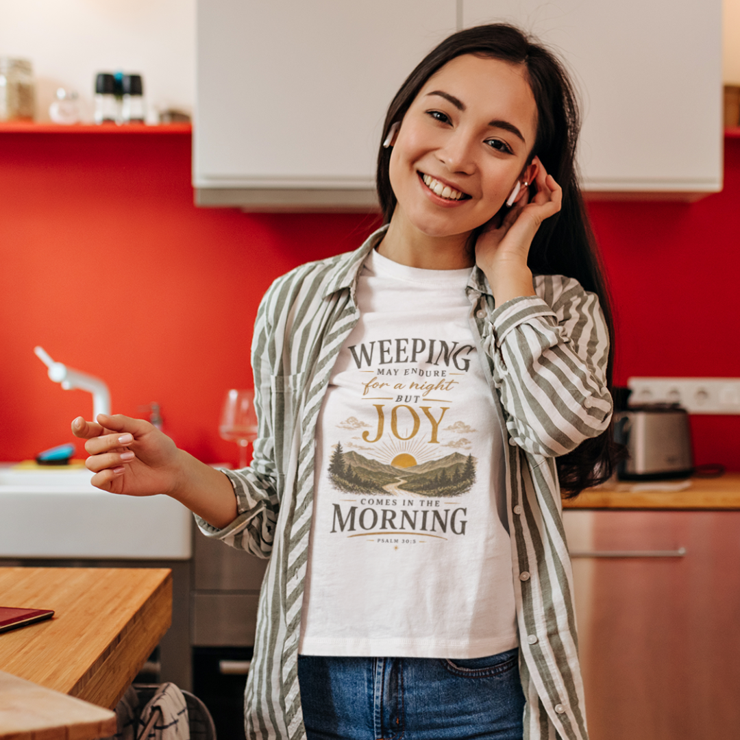 Woman wearing a t-shirt with a motivational quote in a kitchen.
