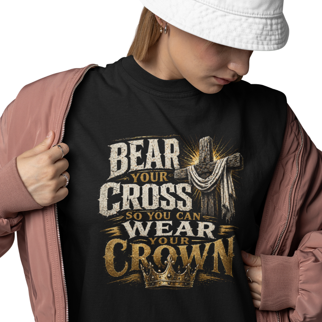 Person wearing a black hoodie with a cross and crown design and text.