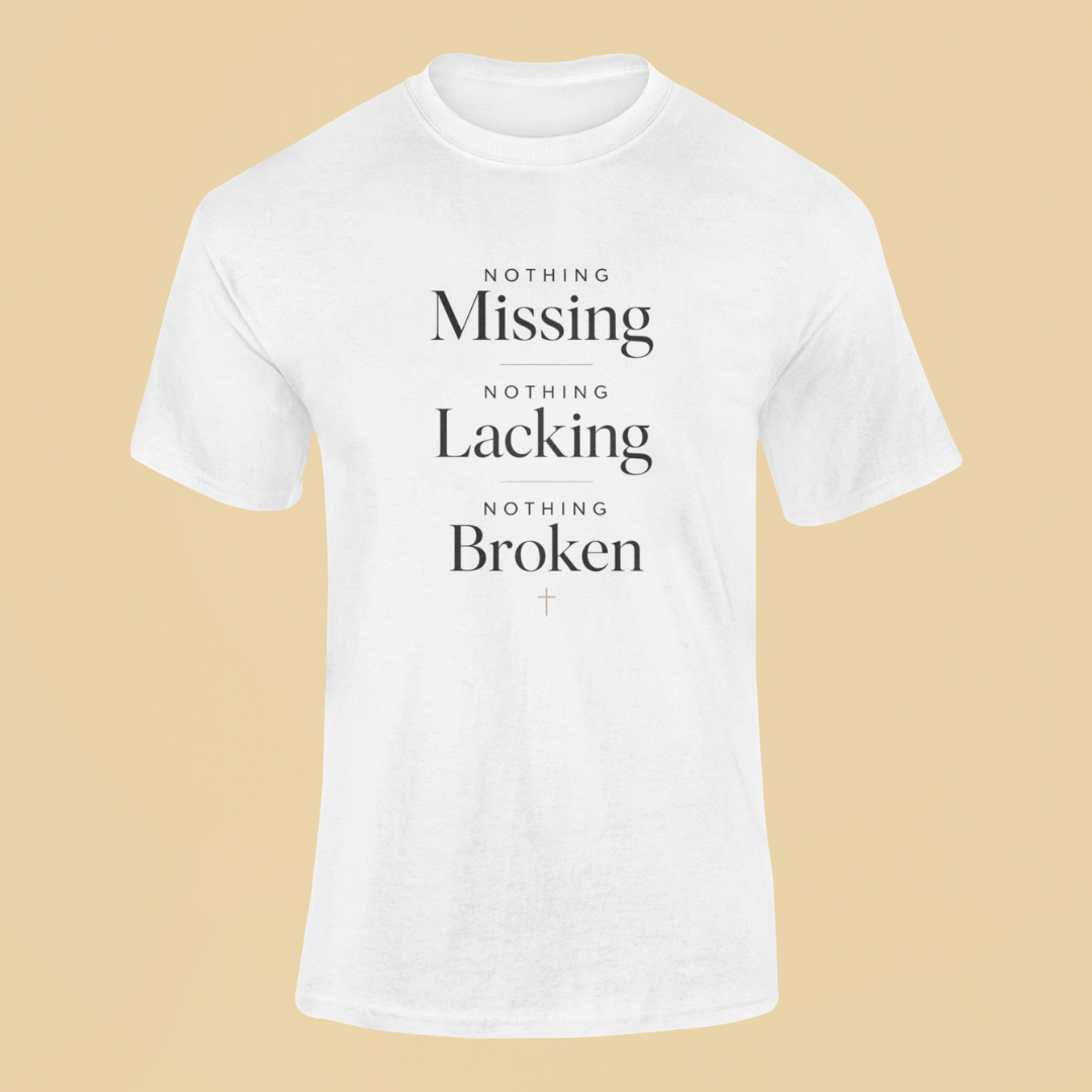 White t-shirt with motivational text on a beige background