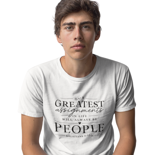 Person wearing a white t-shirt with a motivational quote on a plain background
