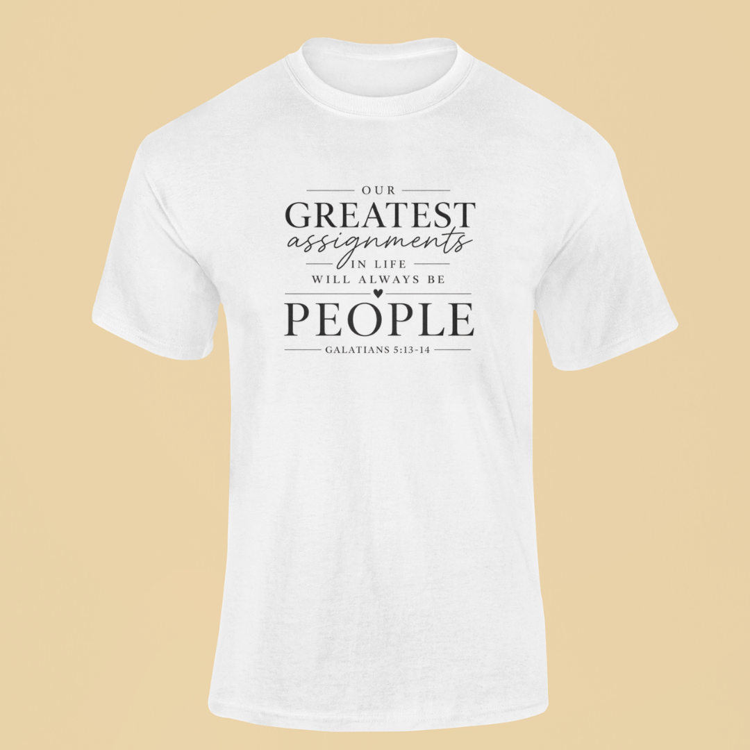 White t-shirt with motivational quote on a beige background