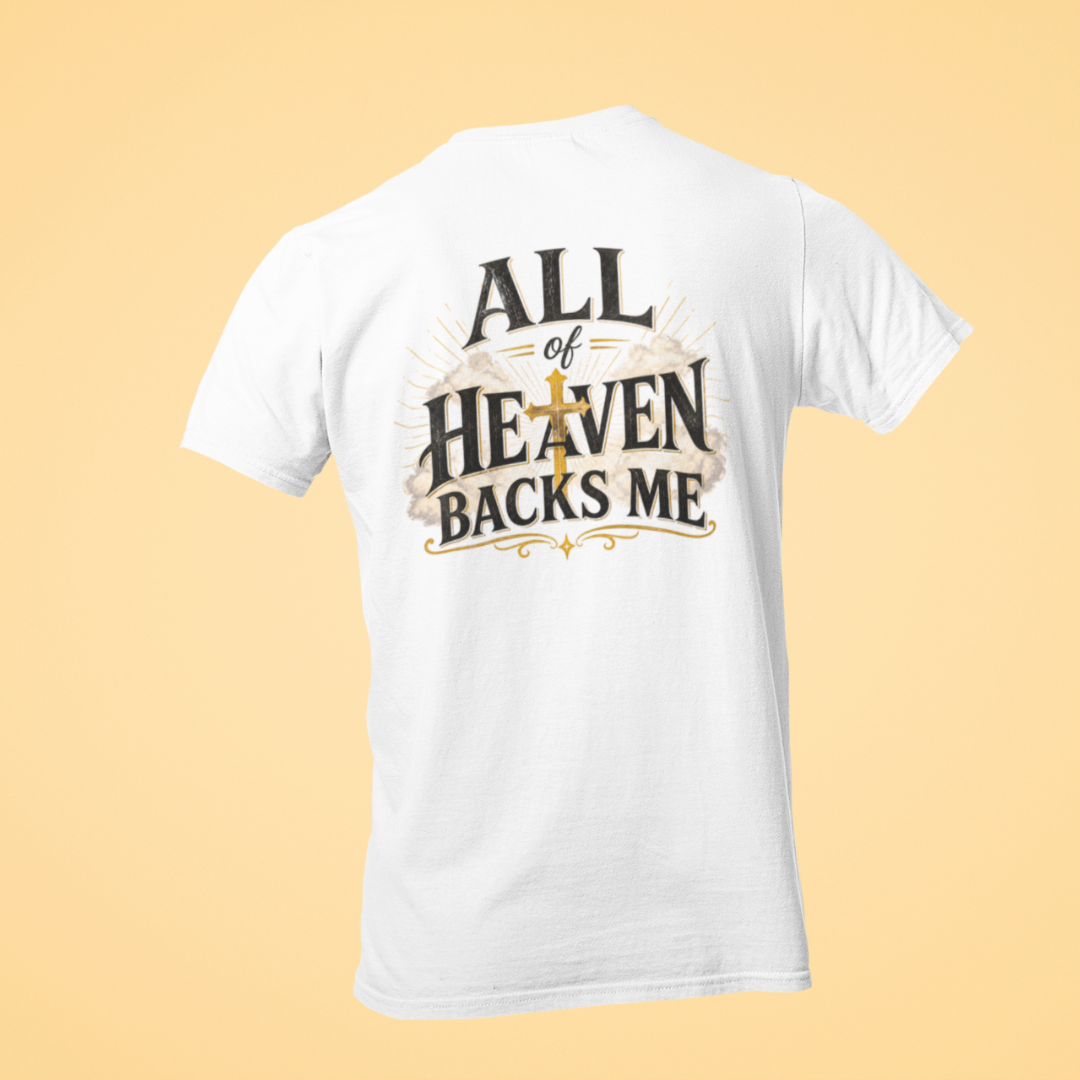 White t-shirt with 'All of Heaven Backs Me' text on a beige background