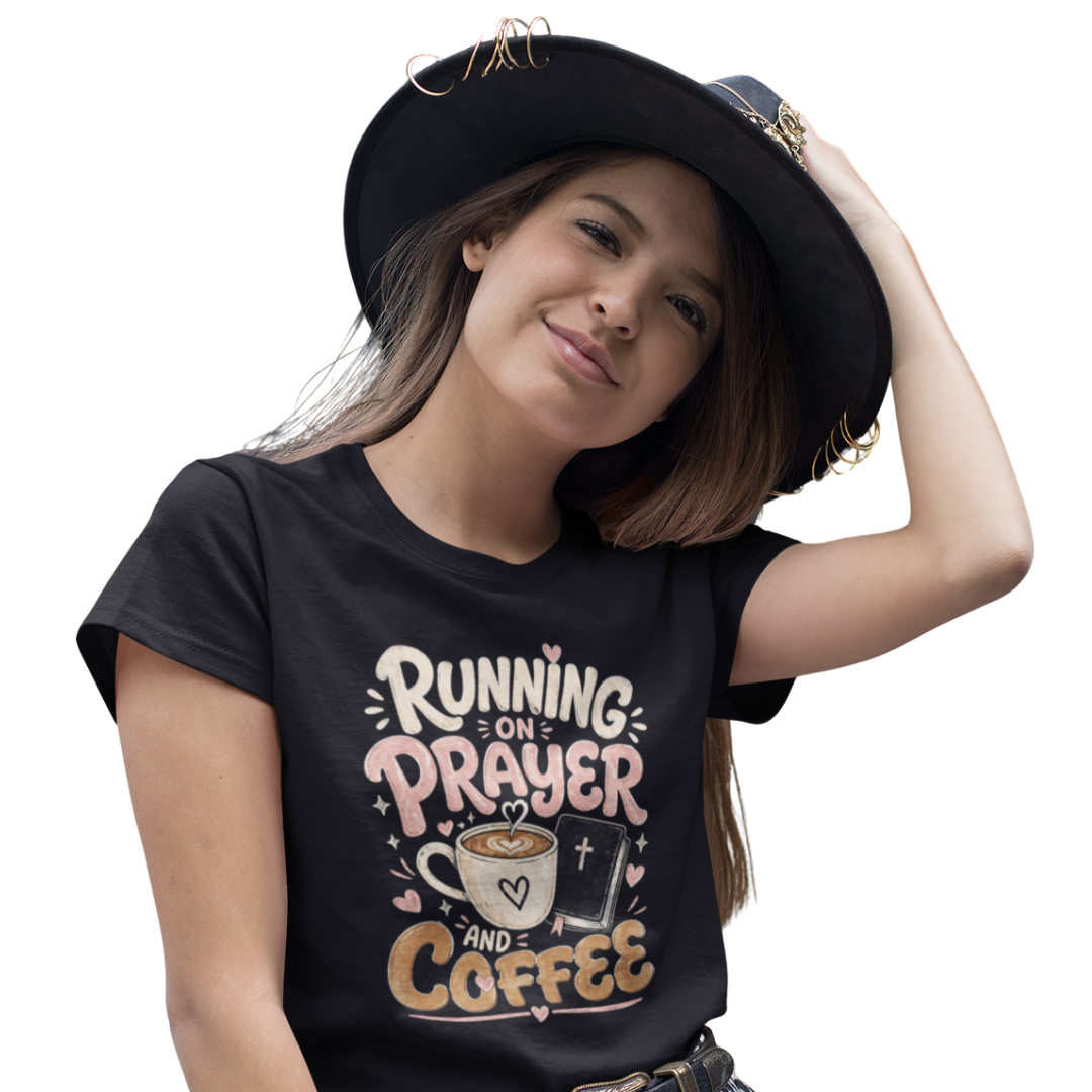 Person wearing a black t-shirt with 'Running on Prayer and Coffee' text and graphics.