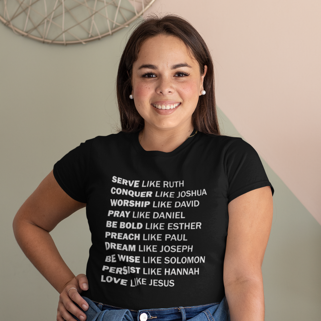 Person wearing a black t-shirt with motivational quotes on a neutral background