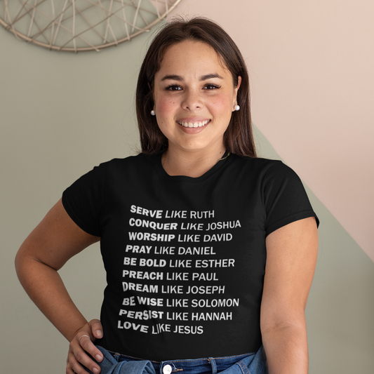 Person wearing a black t-shirt with motivational quotes on a neutral background