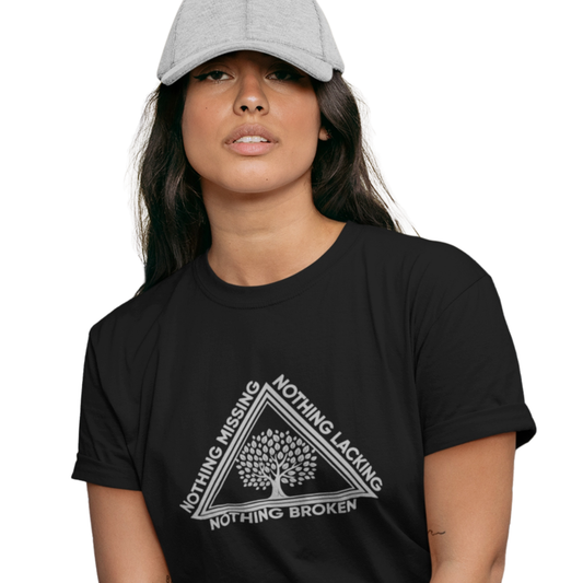 Person wearing a black t-shirt with a tree design and text on a white background