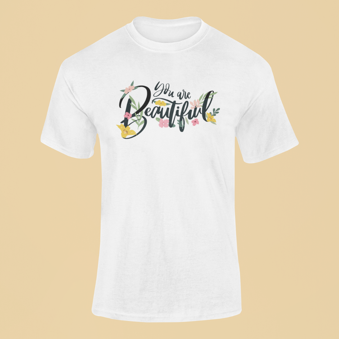 White t-shirt with 'You are Beautiful' text on a beige background